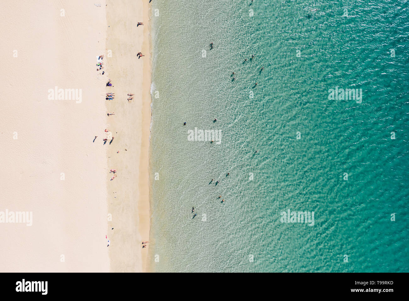 Top down view of peaple enjoying their time on a beach Stock Photo