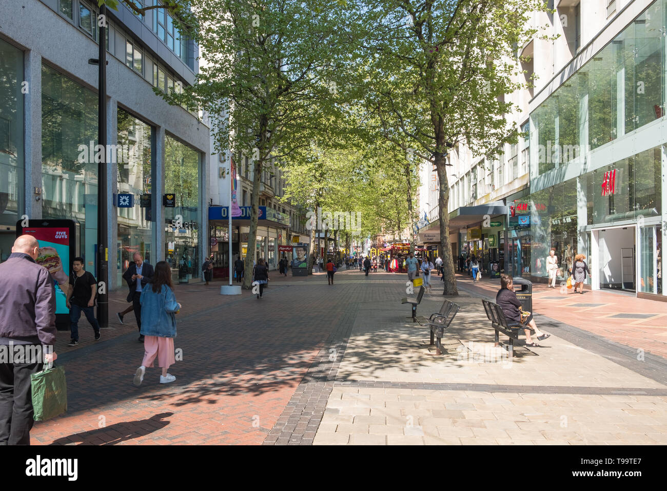 Shoppers in the pedestrianised New Street in Birmingham city centre Stock Photo