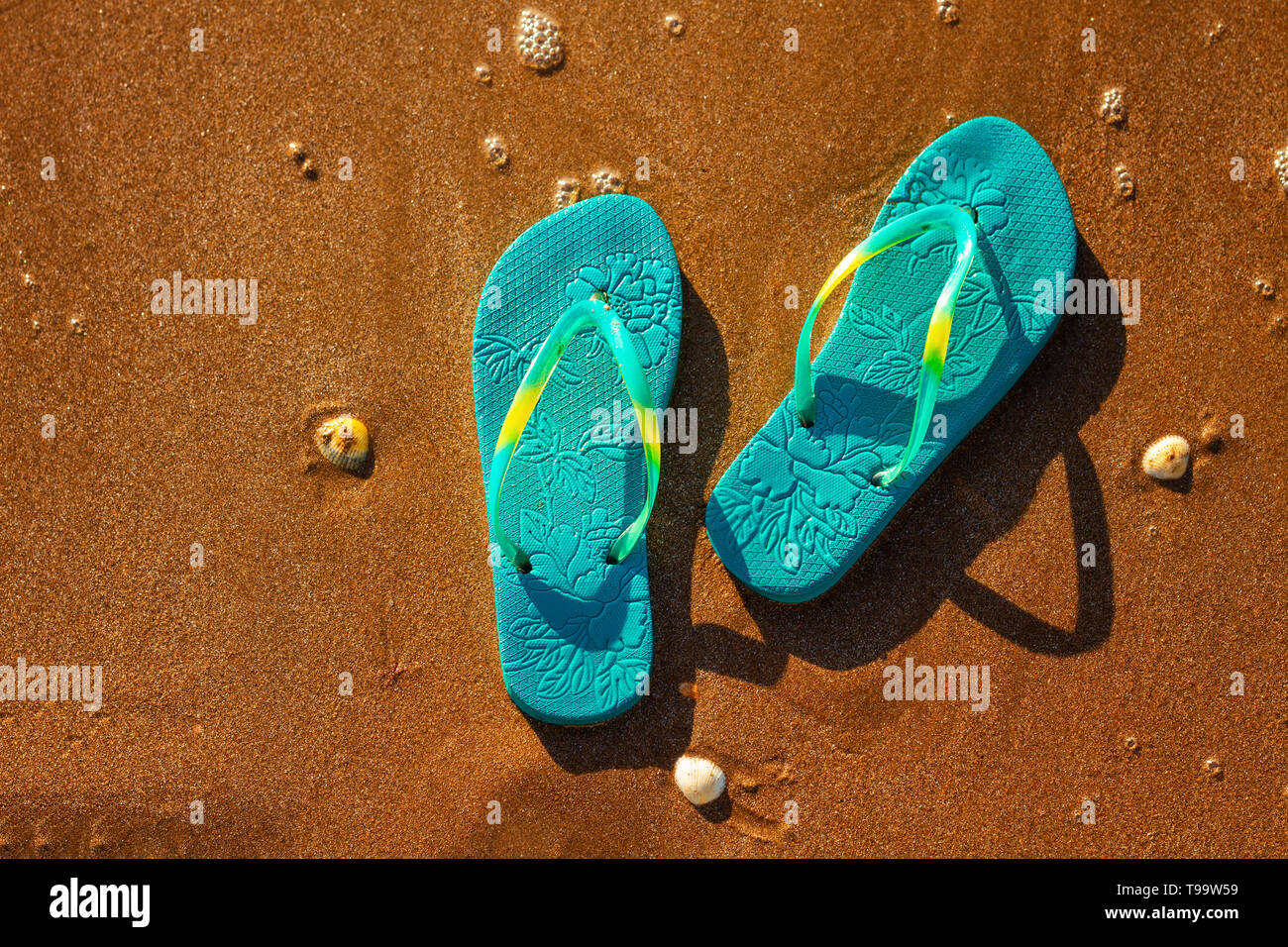 blue sandals on the beach , the concept of rest on the sea Stock Photo ...