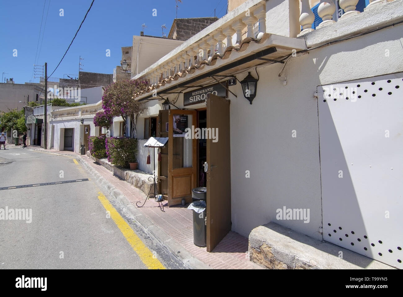 PORTO CRISTO, MALLORCA, SPAIN - MAY 16, 2019: Harbor area restaurant Siroco front on a sunny day on May 16, 2019 in Porto Cristo, Mallorca, Spain. Stock Photo