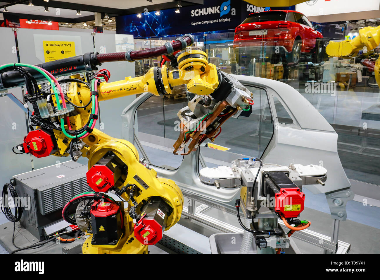 31.03.2019, Hannover, Lower Saxony, Germany - Hanover Fair, industrial robots welding and transporting cars at the Fanuc booth. 00X190331D013CAROEX.JP Stock Photo