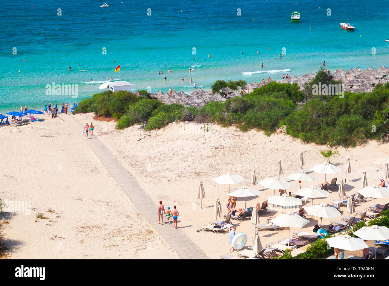 Ayia Napa, Cyprus - June 13, 2018: Public beach of Ayia Napa resort town at the far eastern end of the southern coast of Cyprus island. Ordinary peopl Stock Photo