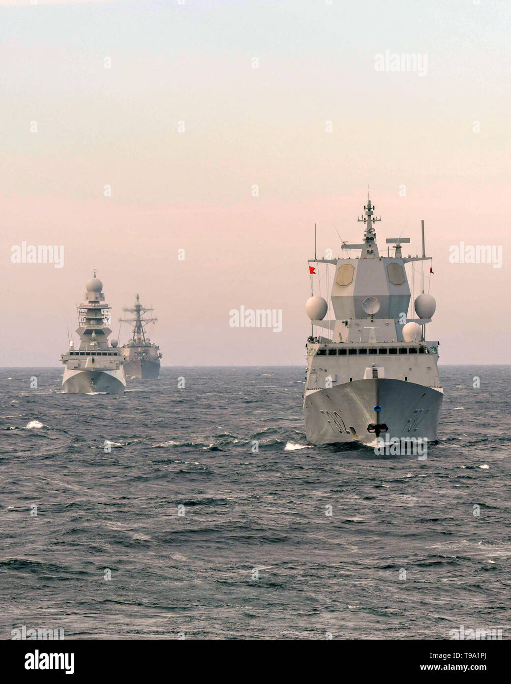The Royal Norwegian Navy frigate HNOMS Otto Sverdrup, Italian Navy Bergamini class frigate ITS Bergamini and the U.S. Navy Arleigh Burke-class guided-missile destroyer USS Roosevelt steam in formation during exercise Formidable Shield 2019 May 13, 2019 in the Atlantic Ocean. Nine nations, including Canada, Denmark, France, Italy, the Netherlands, Norway, Spain, the United Kingdom and the United States are taking part in the NATO exercise. Stock Photo