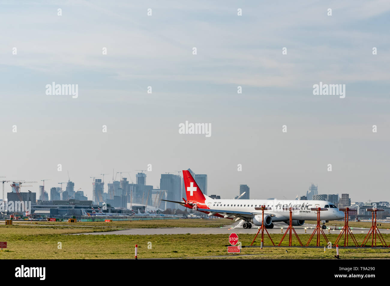 London, UK - 17, February 2019: Helvetic Airways airline based in Zurich Kloten, Switzerland. Aircraft type Embraer ERJ-190 at London City Airport. Stock Photo