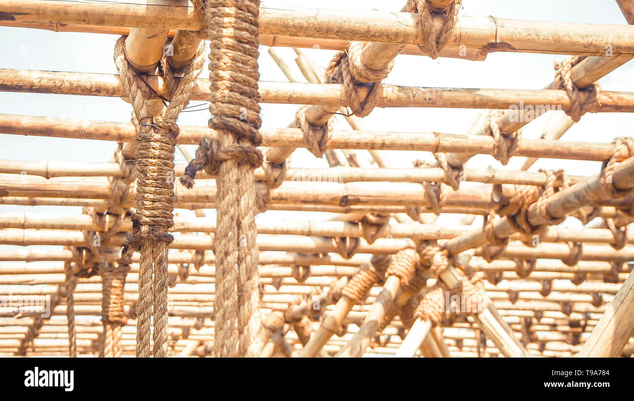 Bamboo panel with a rope tied construction design idea for sustainable eco  green world Stock Photo - Alamy