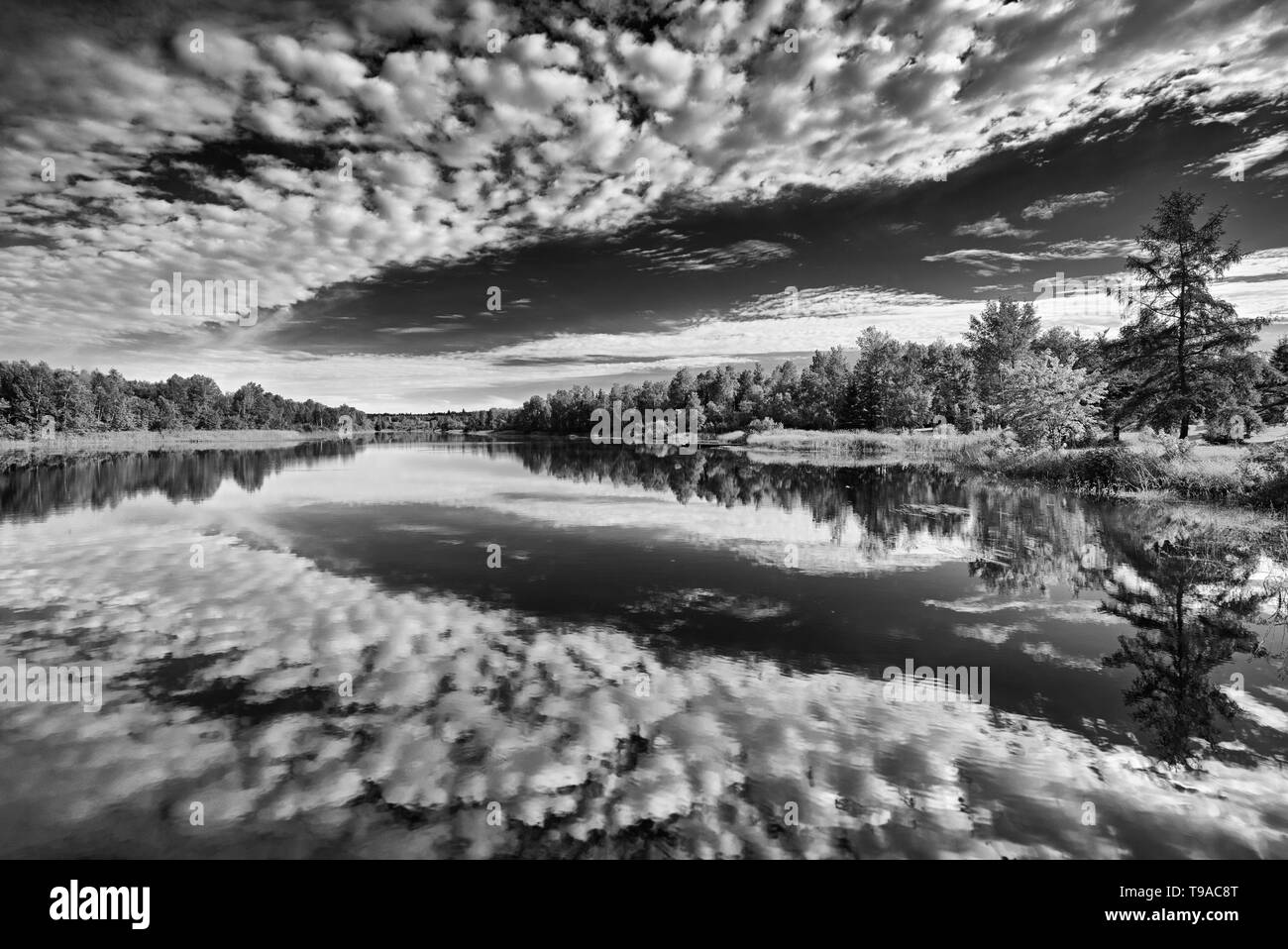 Cloud reflection on Riviere Fraser Latulipe Quebec Canada Stock Photo