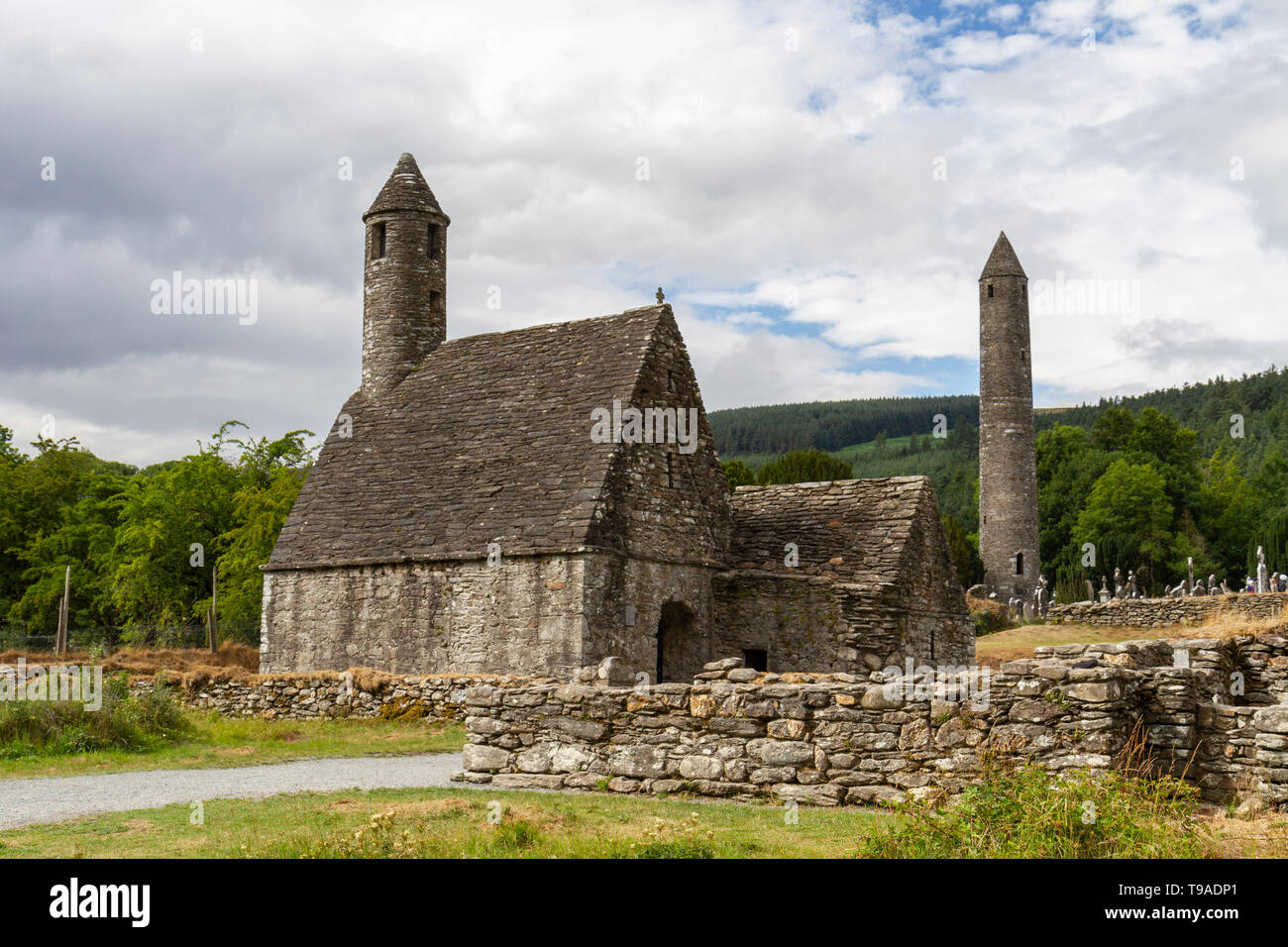 St. Kevin's church with the Glendalough Roundtower in Glendalough, County Wicklow, Ireland. Stock Photo