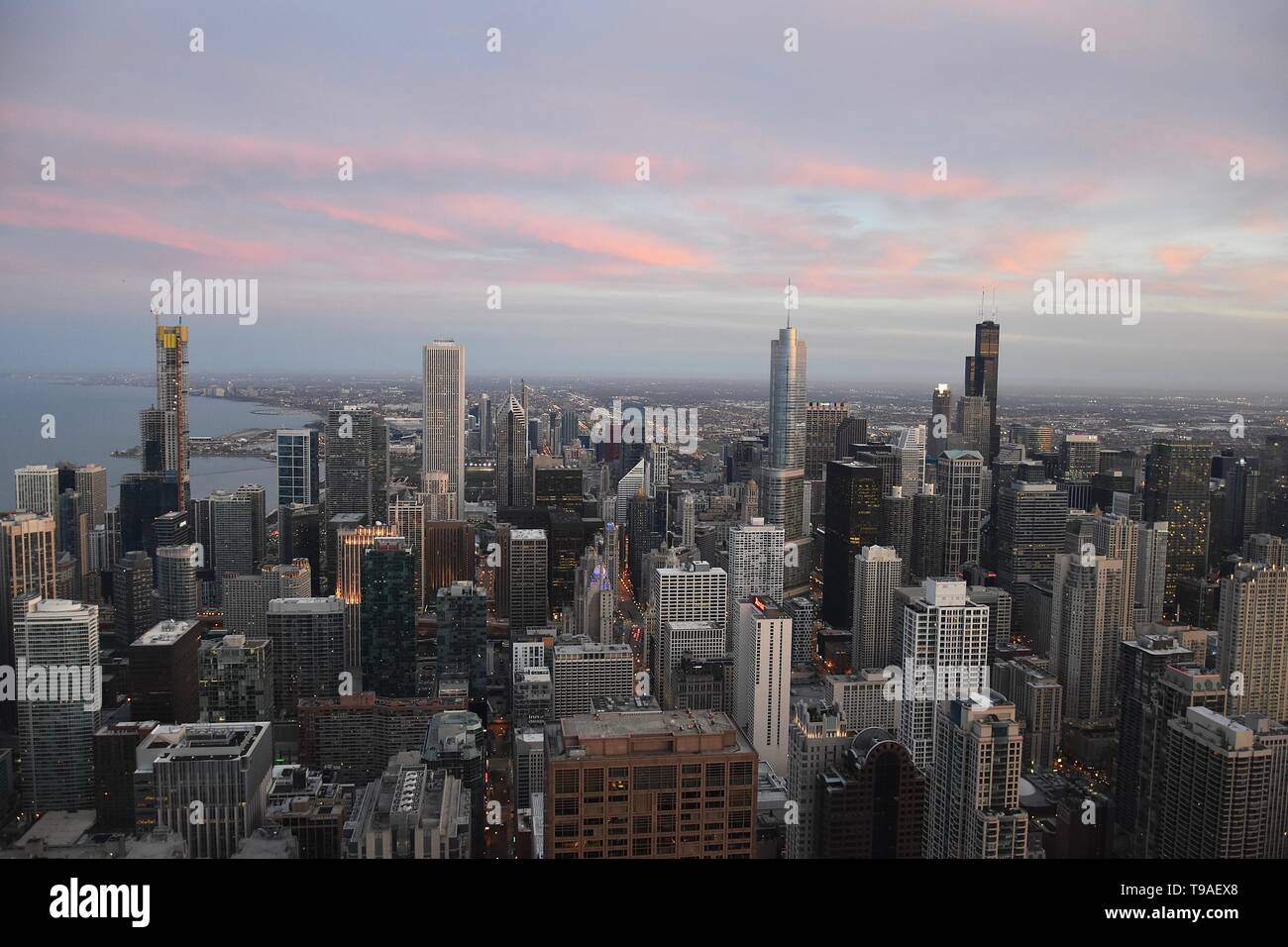 Chicago at sunset as seen from above at 360 Chicago atop the John Hancock Center, Near North Side, Magnificent Mile, Chicago, Illinois, USA Stock Photo