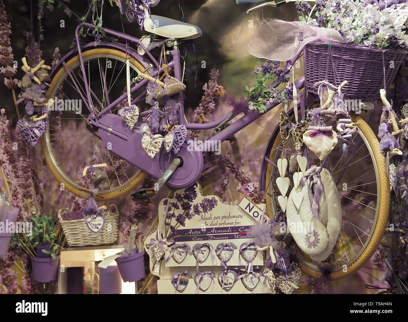 Purple bicycle hanging in a shop for decoration Stock Photo