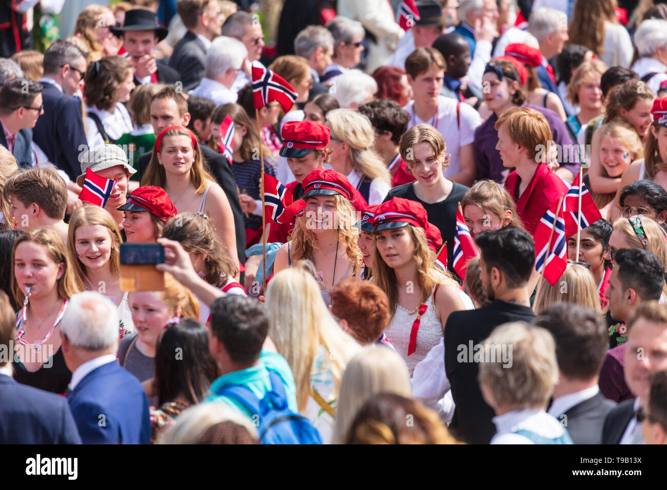 Norway, Oslo - May 17, 2019. Norwegians in all ages and dressed up in  traditional costumes parade Slottsplassen during the annual celebration of  the Norwegian Constitution Day, also referred to as Sytttende