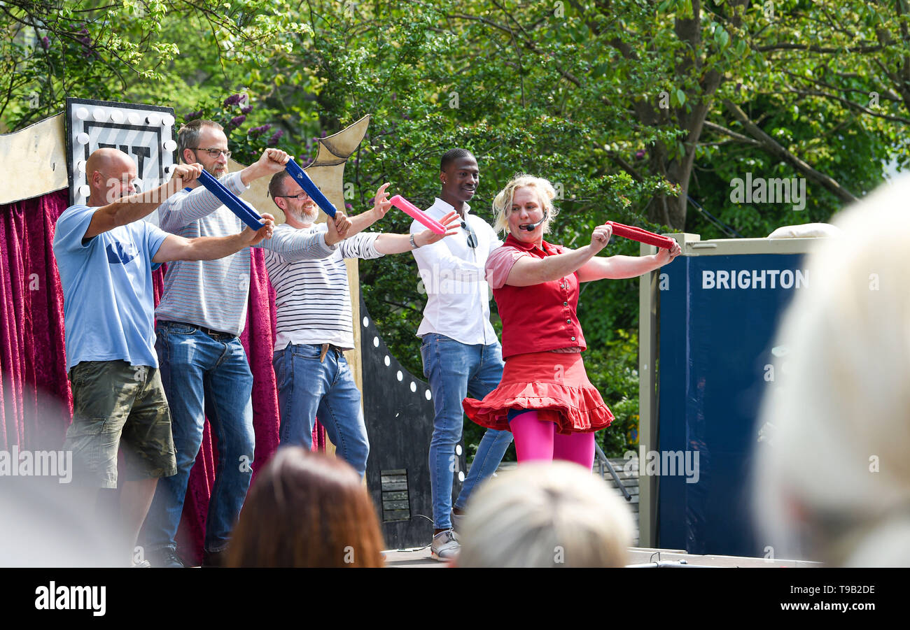 Brighton UK 18th May 2019 -  Audience participation at the Fringe City street entertainment which is part of the Brighton Festival 2019 . Credit : Simon Dack / Alamy Live News Stock Photo