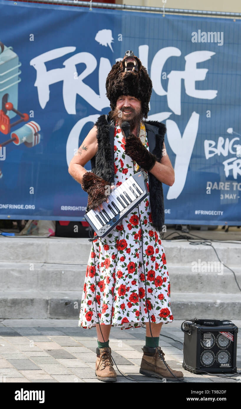 Brighton UK 18th May 2019 - A singing bear in a dress part of the 'Bear North' show at the Fringe City street entertainment which is part of the Brighton Festival 2019 . Credit : Simon Dack / Alamy Live News Stock Photo