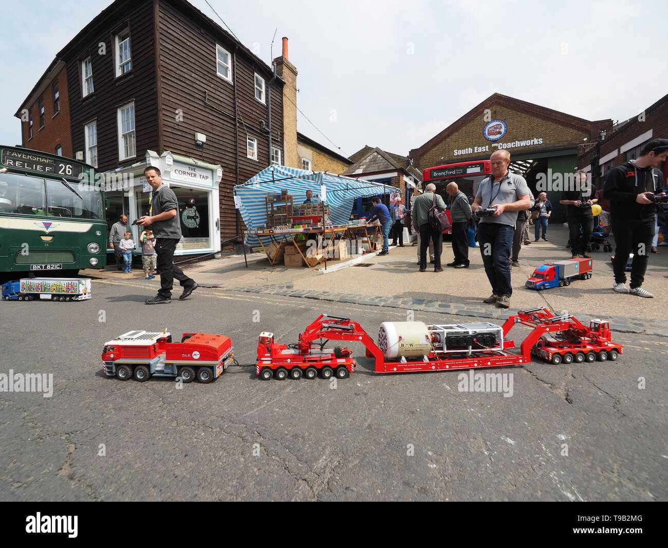 Faversham, Kent, UK. 18th May, 2019. 25th Faversham Transport Weekend: the first day of this annual transport festival show casing a range of vintage buses and commercial transport. Pic: remote control scale model trucks take to Faversham high street to the delight of visitors. Credit: James Bell/Alamy Live News Stock Photo