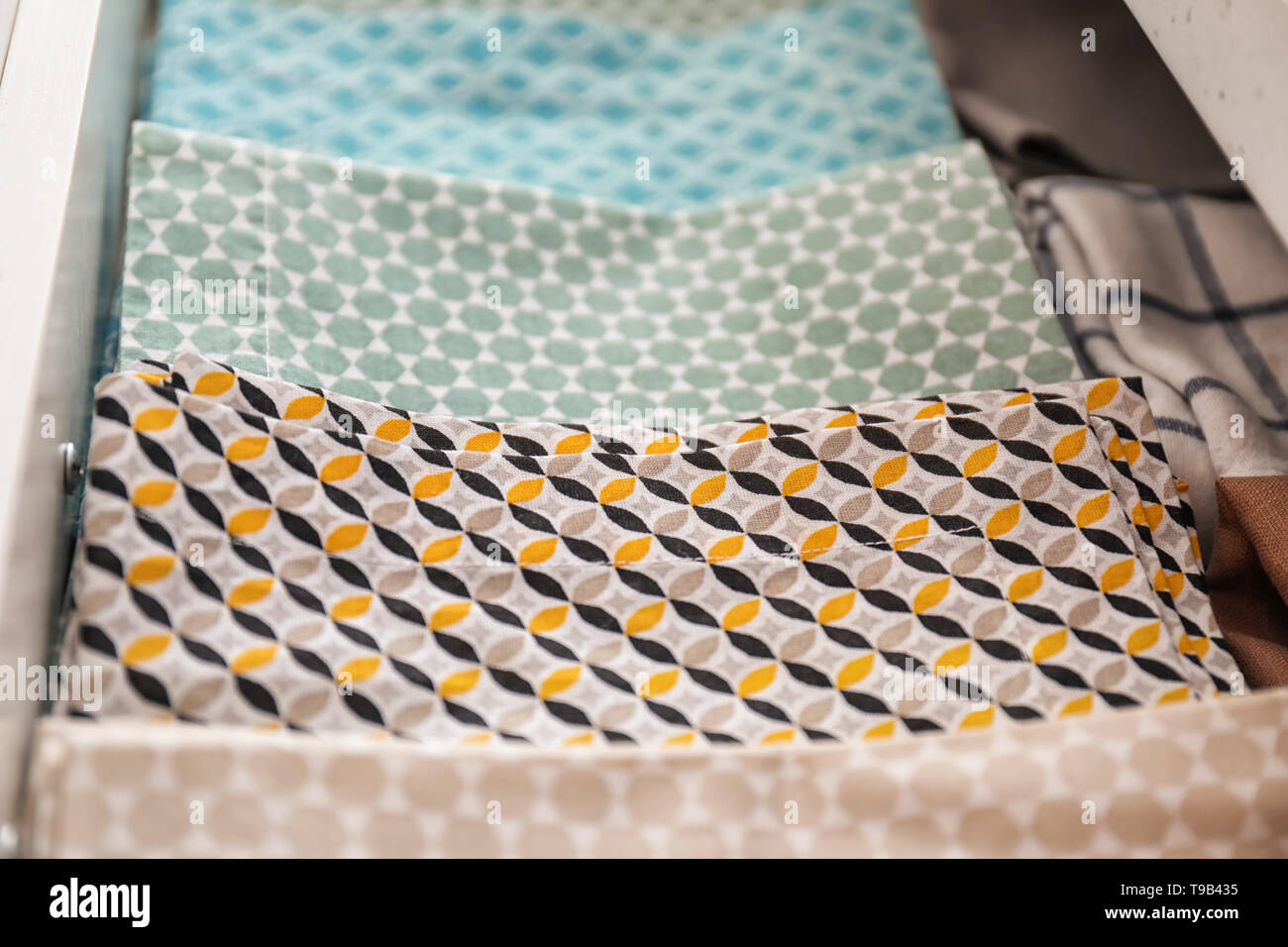 Clean kitchen towels in drawer Stock Photo