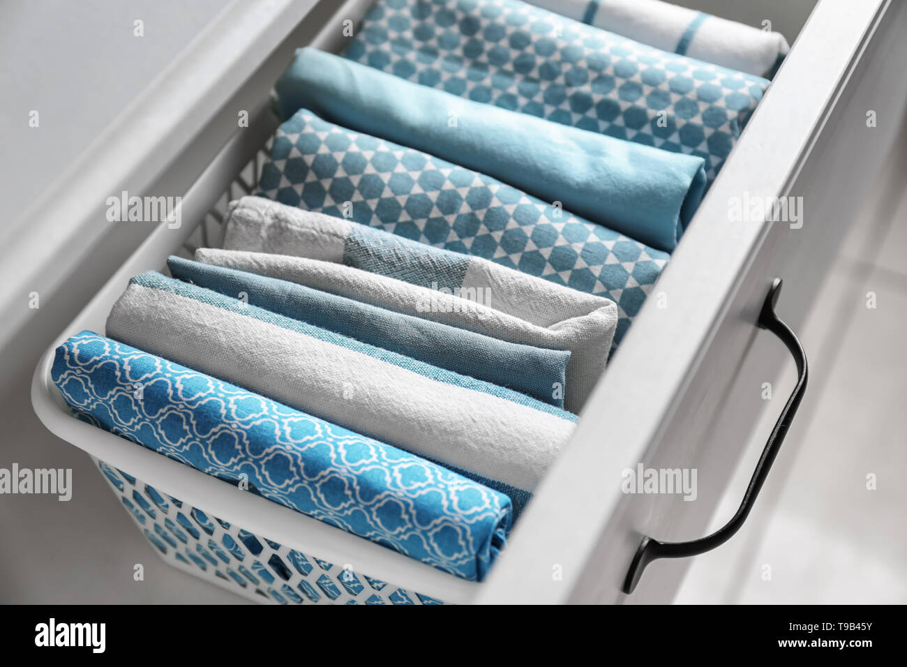 Clean kitchen towels in drawer Stock Photo