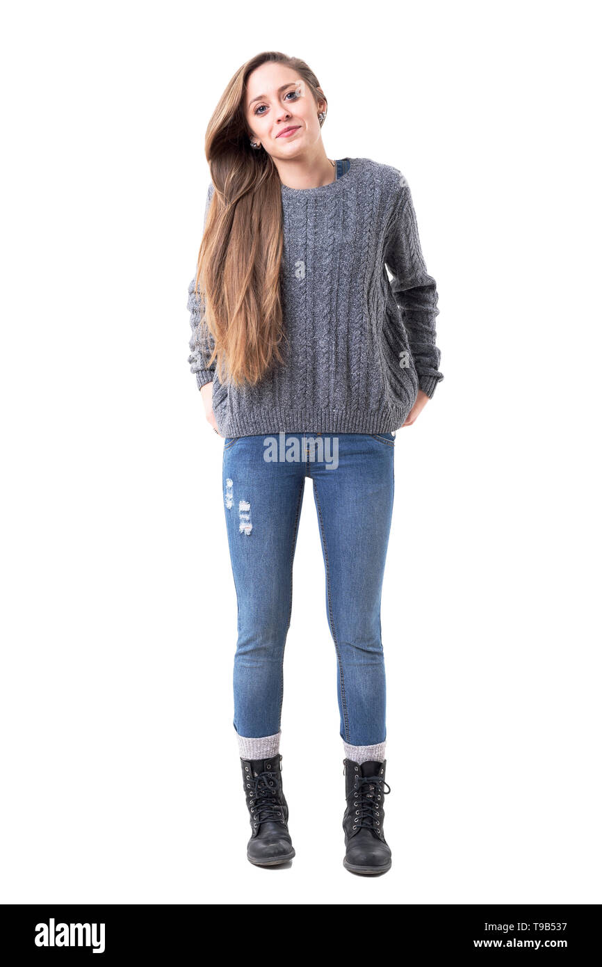Cool funky young stylish woman in gray sweater and jeans posing with hands  in back pockets. Full body isolated on white background Stock Photo - Alamy