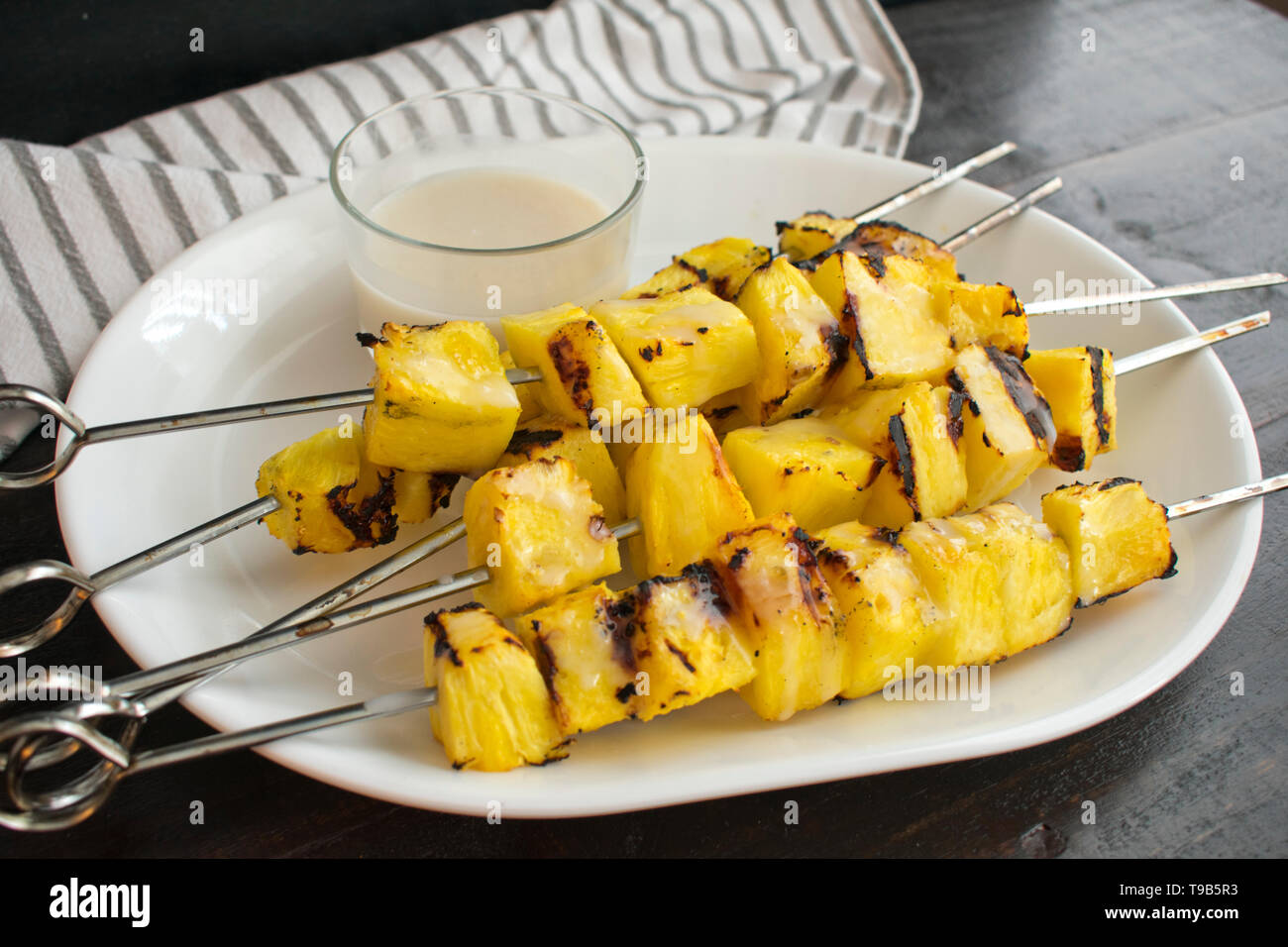 Grilled Pineapple with Coconut Sauce Stock Photo Alamy