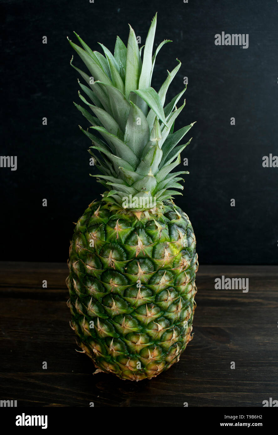 Whole Pineapple on a Dark Background Stock Photo