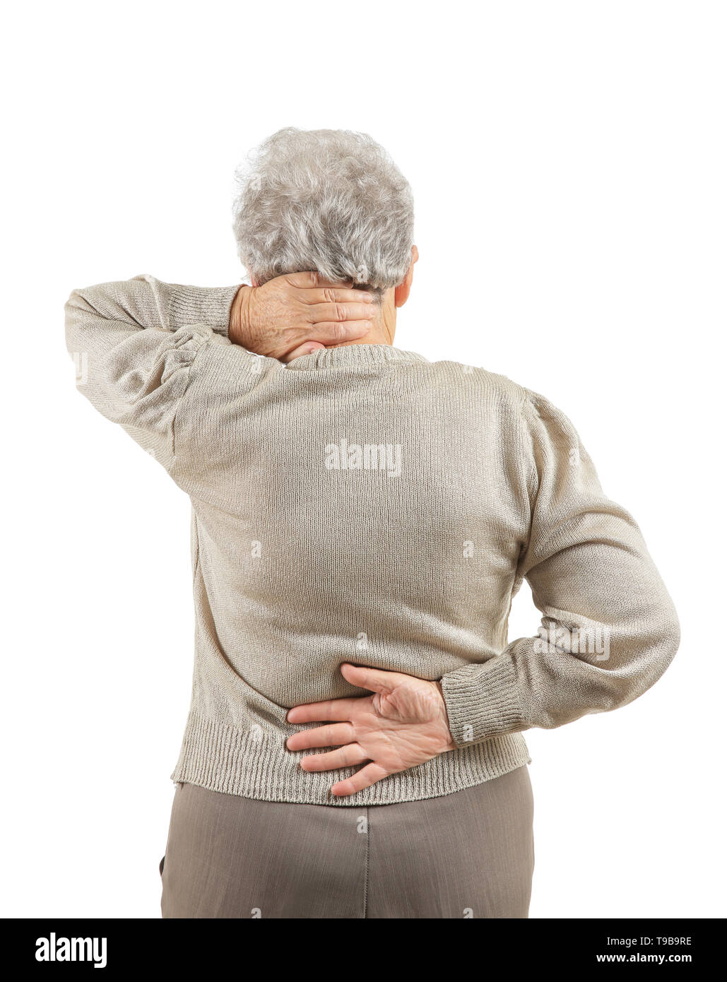 Senior woman suffering from back pain on white background Stock Photo ...