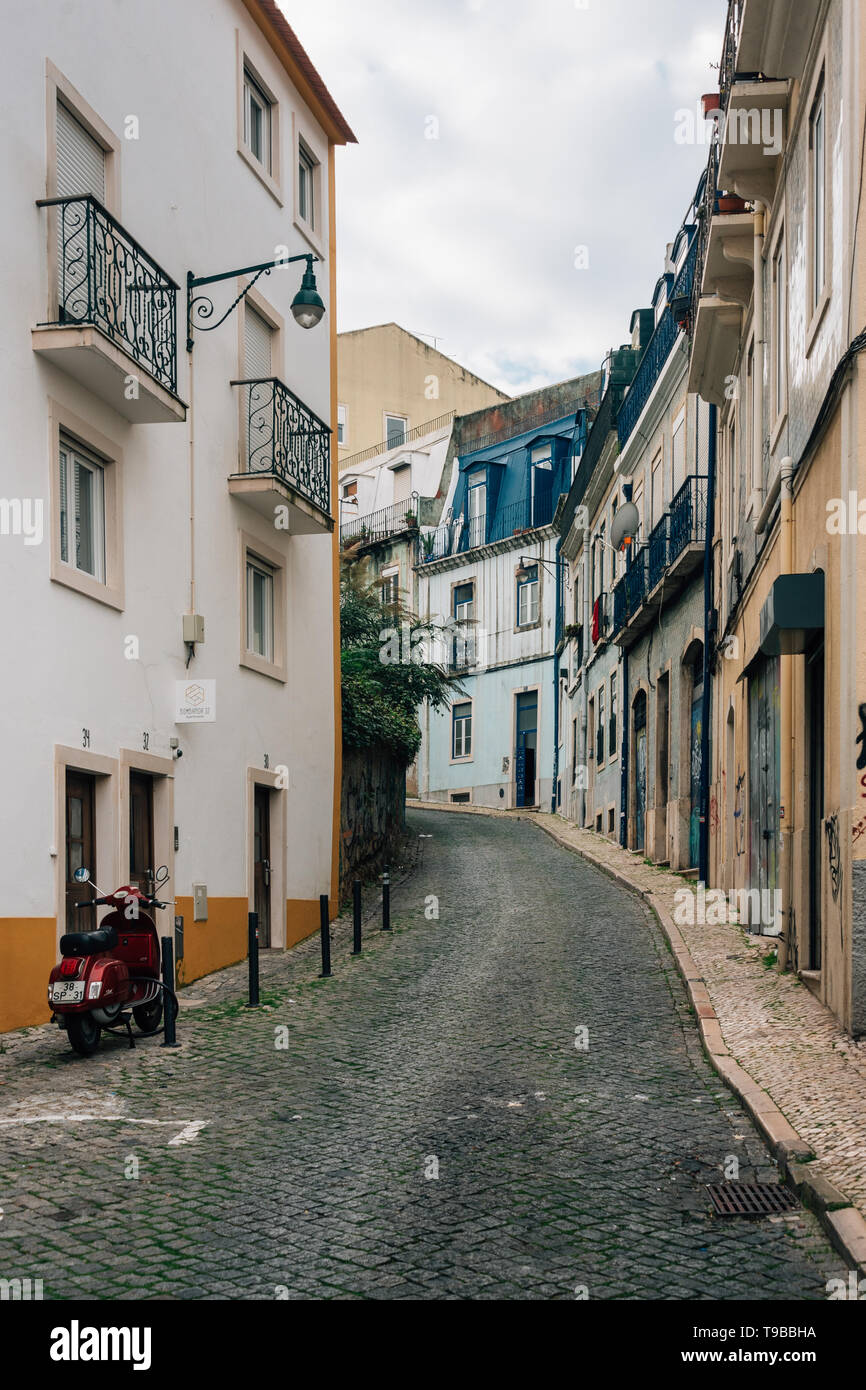 A narrow cobblestone street in Lisbon, Portugal Stock Photo - Alamy