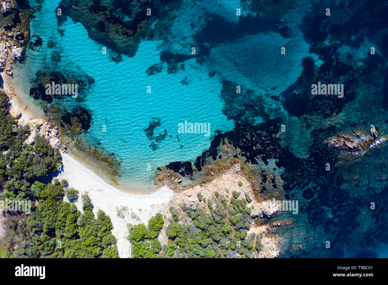 View from above, stunning aerial view of the Capriccioli Beach bathed ...