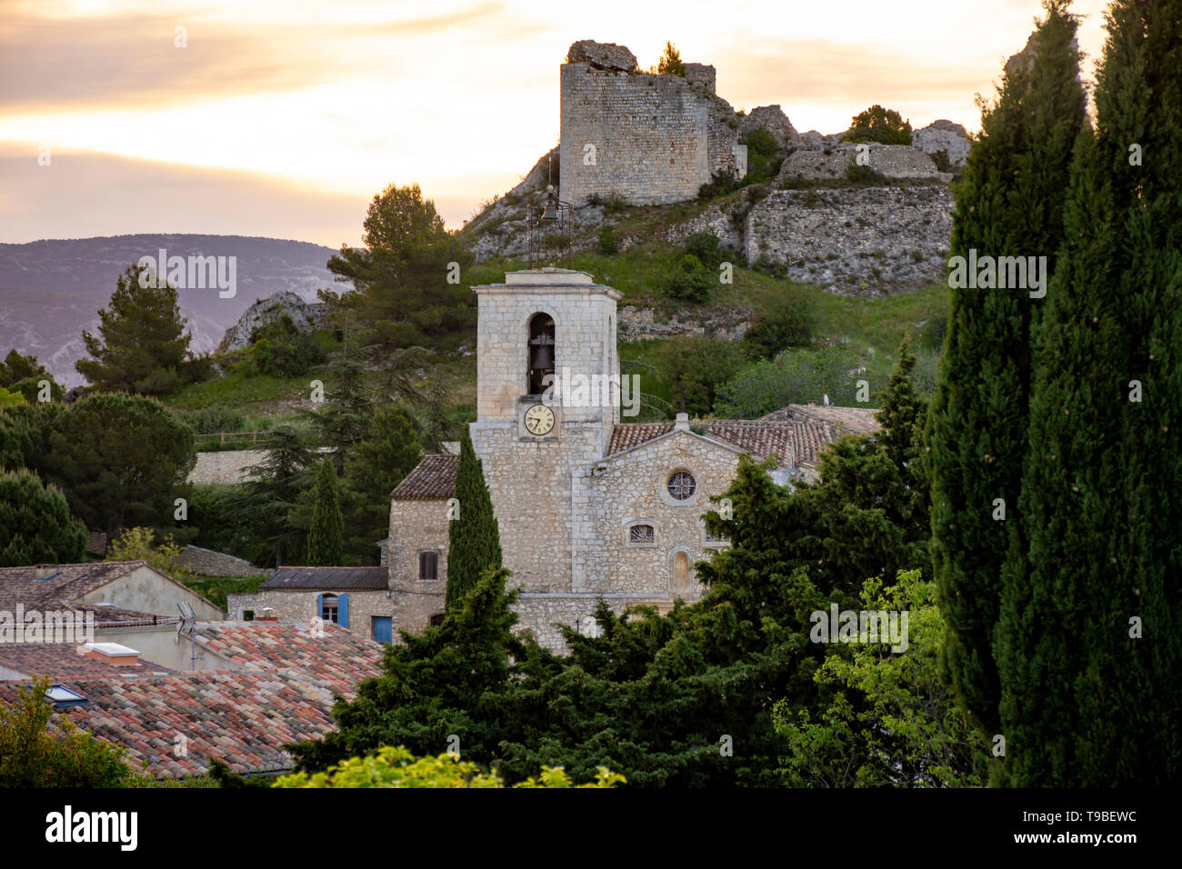 View on traditional medieval houses and castle ruines in Provence during sunrise, South of France, vacation and tourist destination Stock Photo