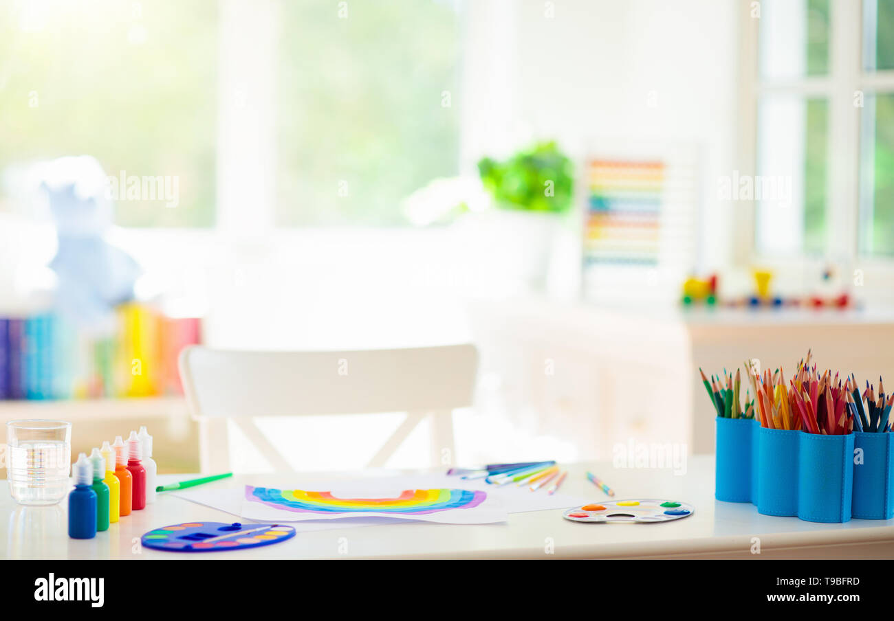 Kids Painting In White Bedroom At Wooden Desk Arts And Crafts