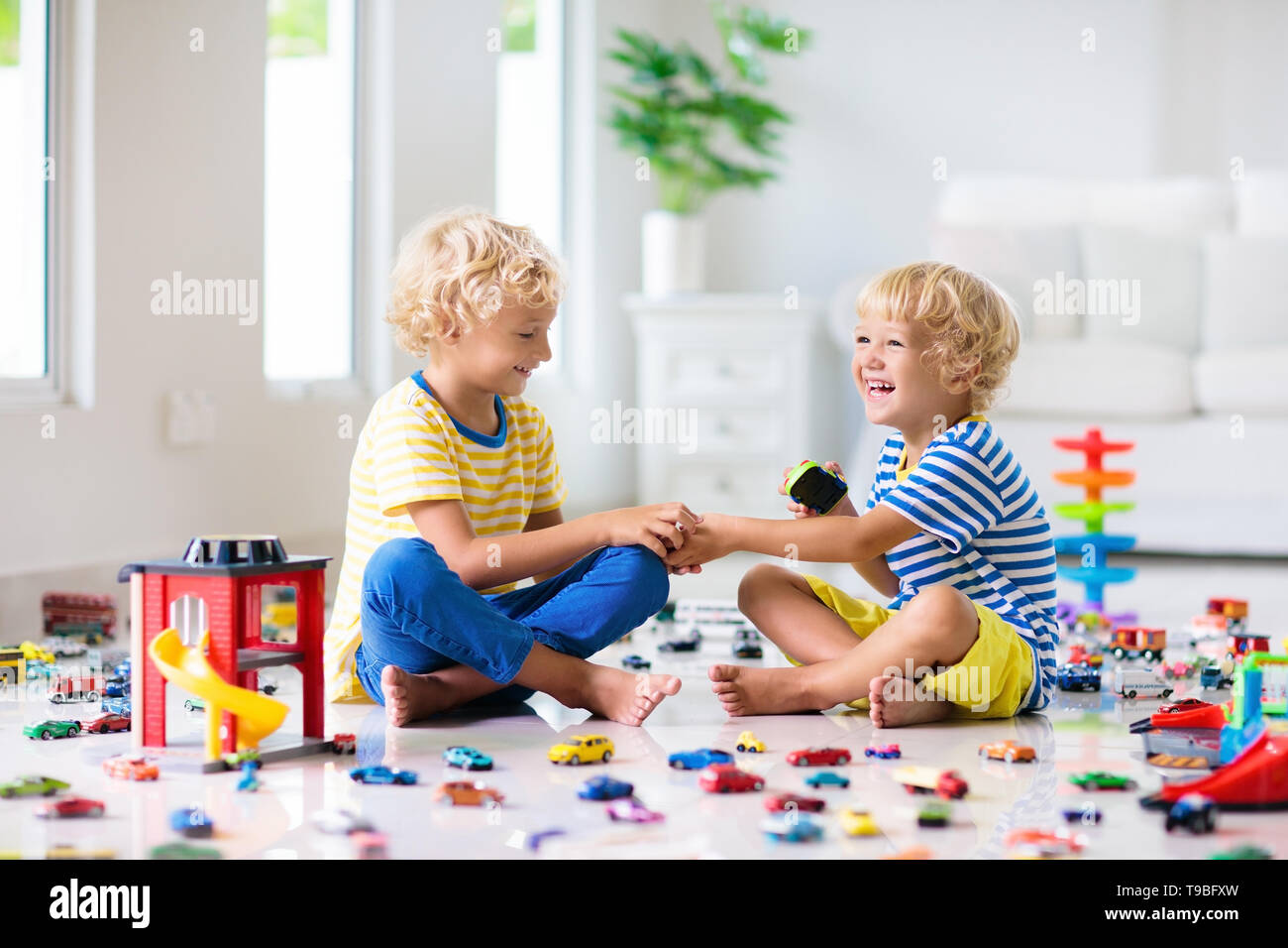 kids playing with toy cars
