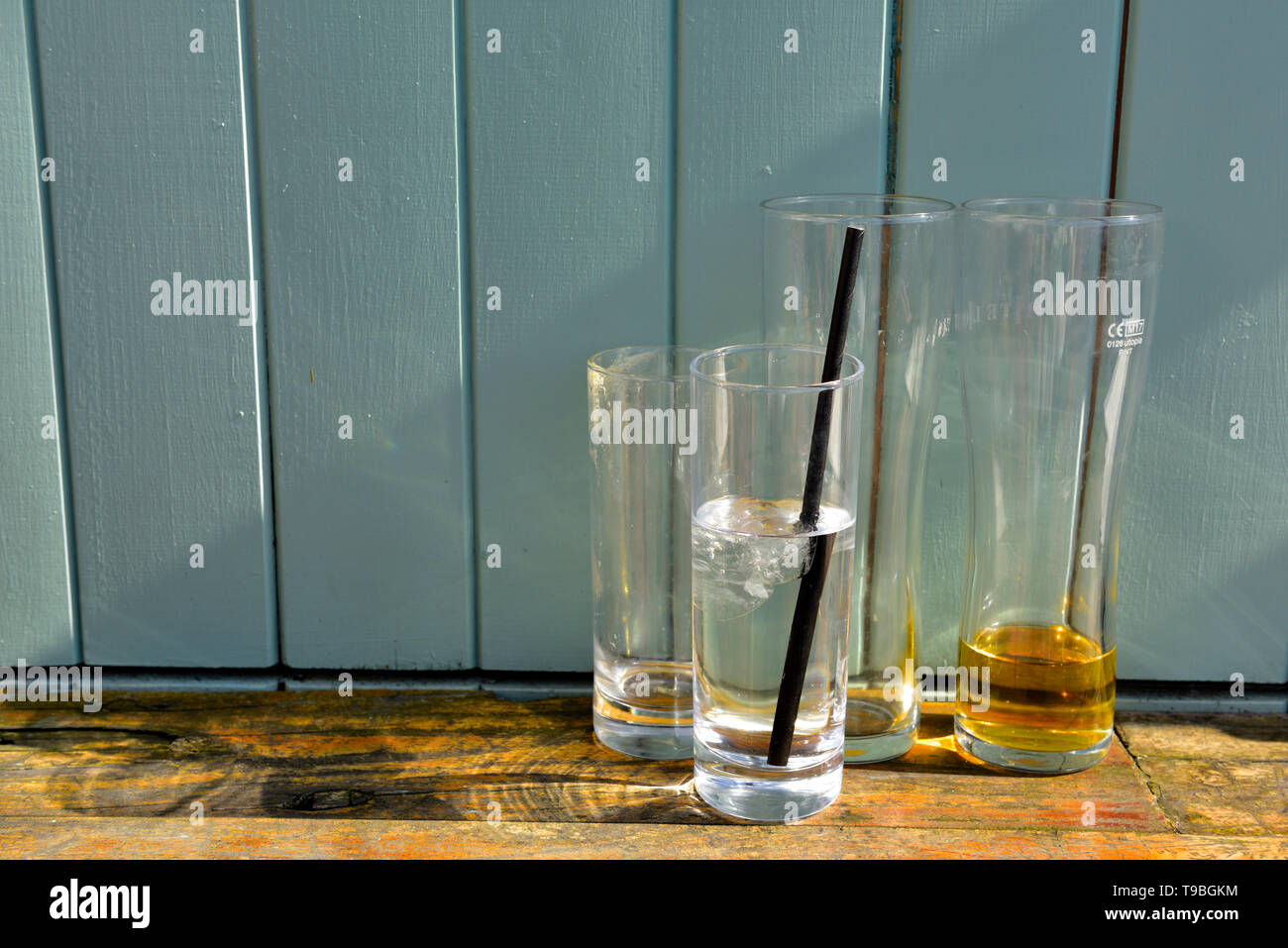 Part empty drinks glasses casting shadows Stock Photo
