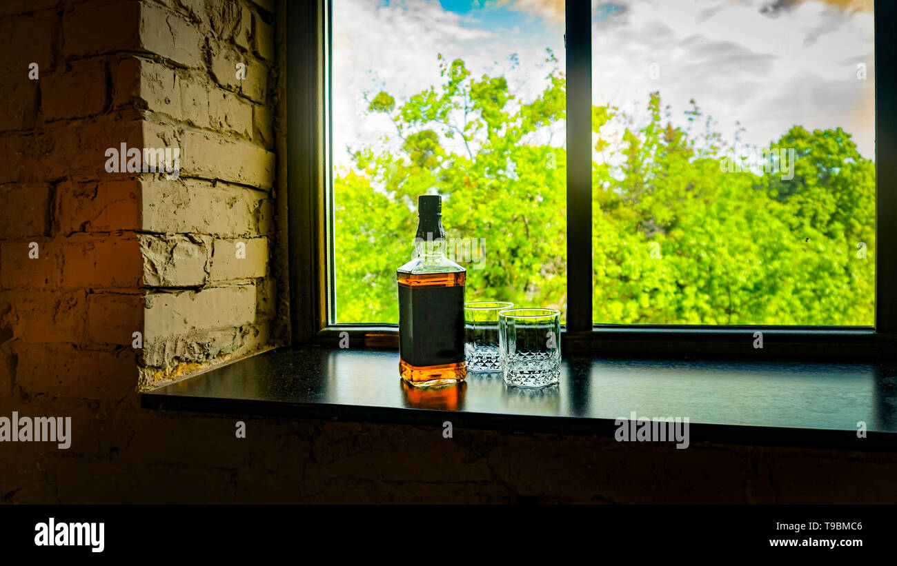 Download Bottle Of Whiskey And Whiskey Glasses Near The Window With A Beautiful View Stock Photo Alamy PSD Mockup Templates
