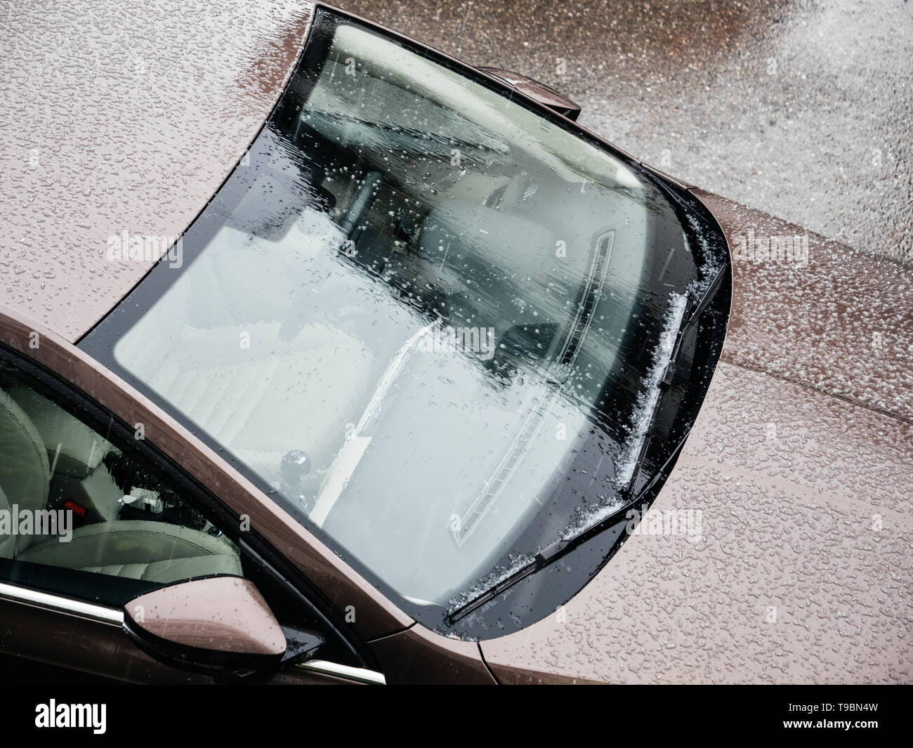 View From Above Over New Car Windshields Covered With Tiny Hail During view-from-above-over-new-car-windshields-covered-with-tiny-hail-during
