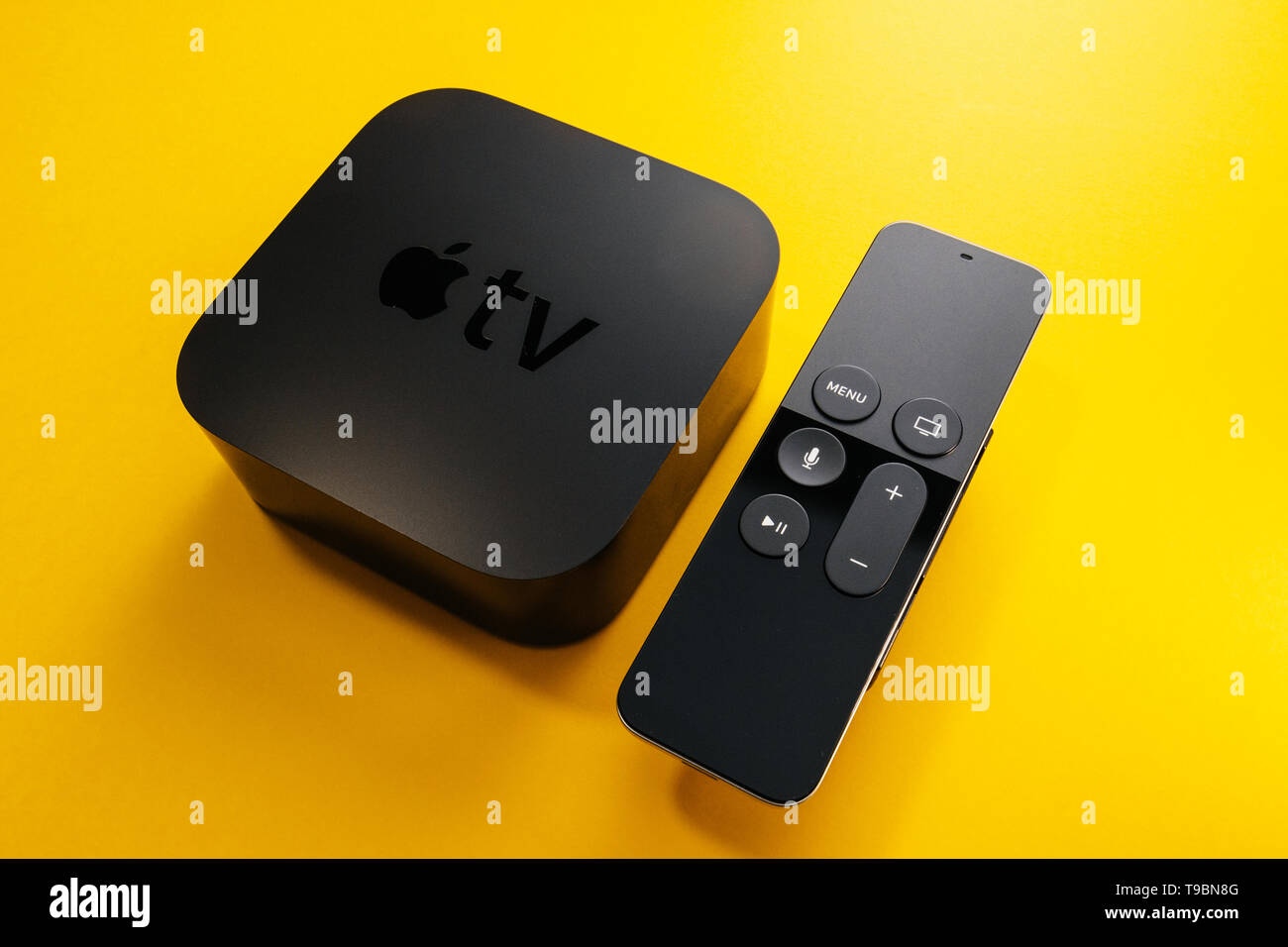 Paris, France - Nov 16, 2018: Side view of from above at black Apple TV 4K media streaming by Apple Computers against yellow background - tilt-shift lens used Stock Photo - Alamy