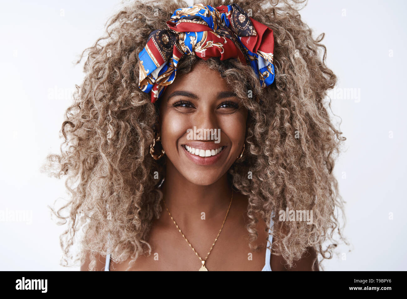 Close-up gorgeous stylish african-american young 25s woman, pierced nose headband, laughing smile sincere have fun enjoy awesome lively party talking Stock Photo