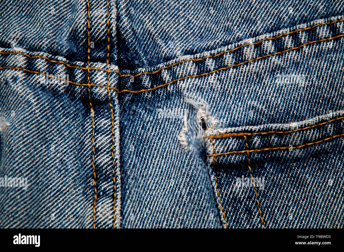 hole in jeans back pocket