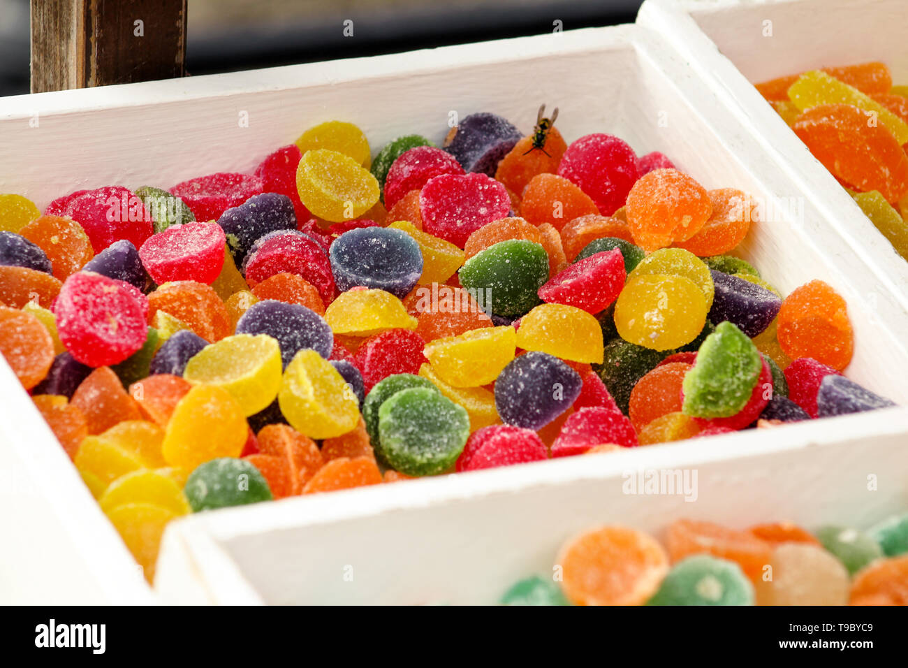 Different gelatin sweet fruit candy candies sugar. Assorted colorful jelly sweets. Colored confectionery for kids. Delicious multicolor of candies. Stock Photo