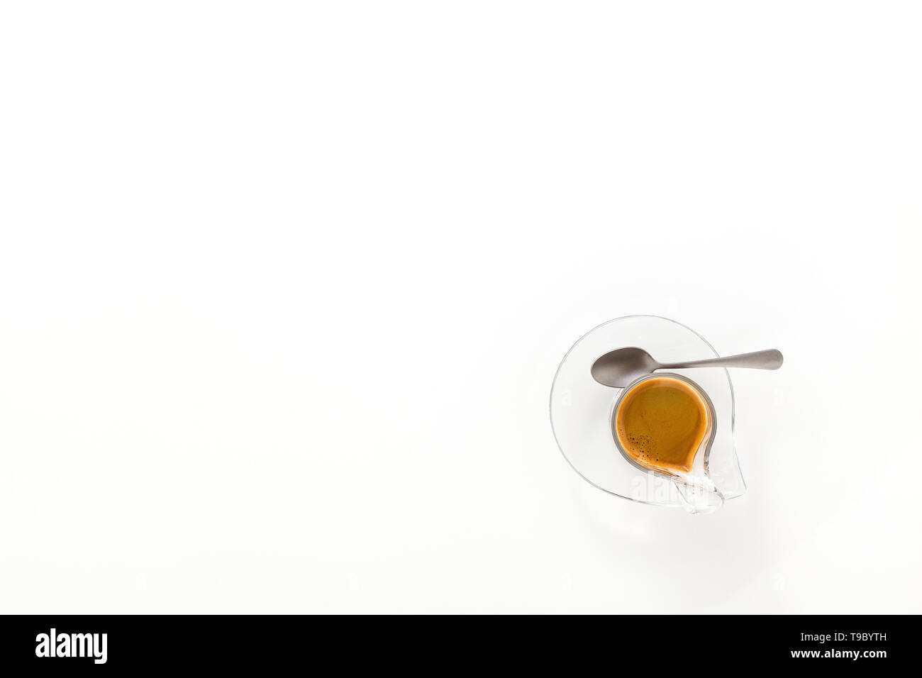Italian espresso coffee in glass cup isolated on white background. copy space Stock Photo