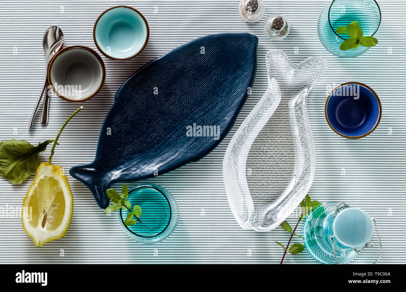 empty fish-shaped plates on a festive served table Stock Photo