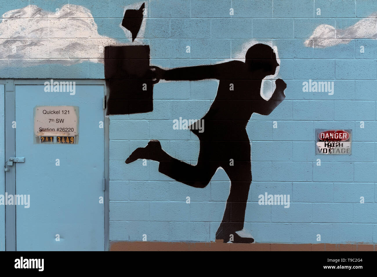 mural depicting 'dashing commuter' in silhouette Stock Photo