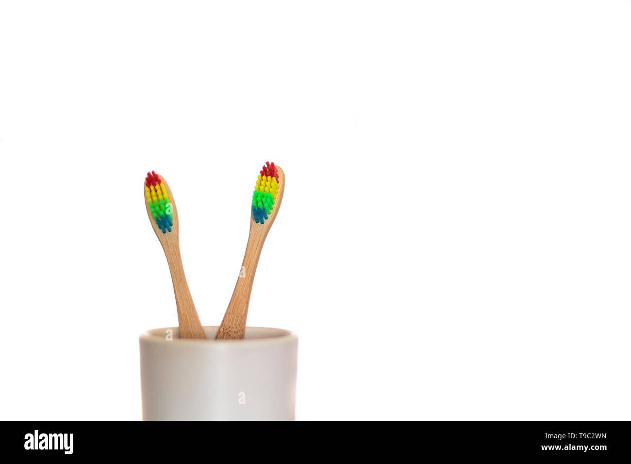 Two ecological bamboo toothbrushes on white background Stock Photo - Alamy
