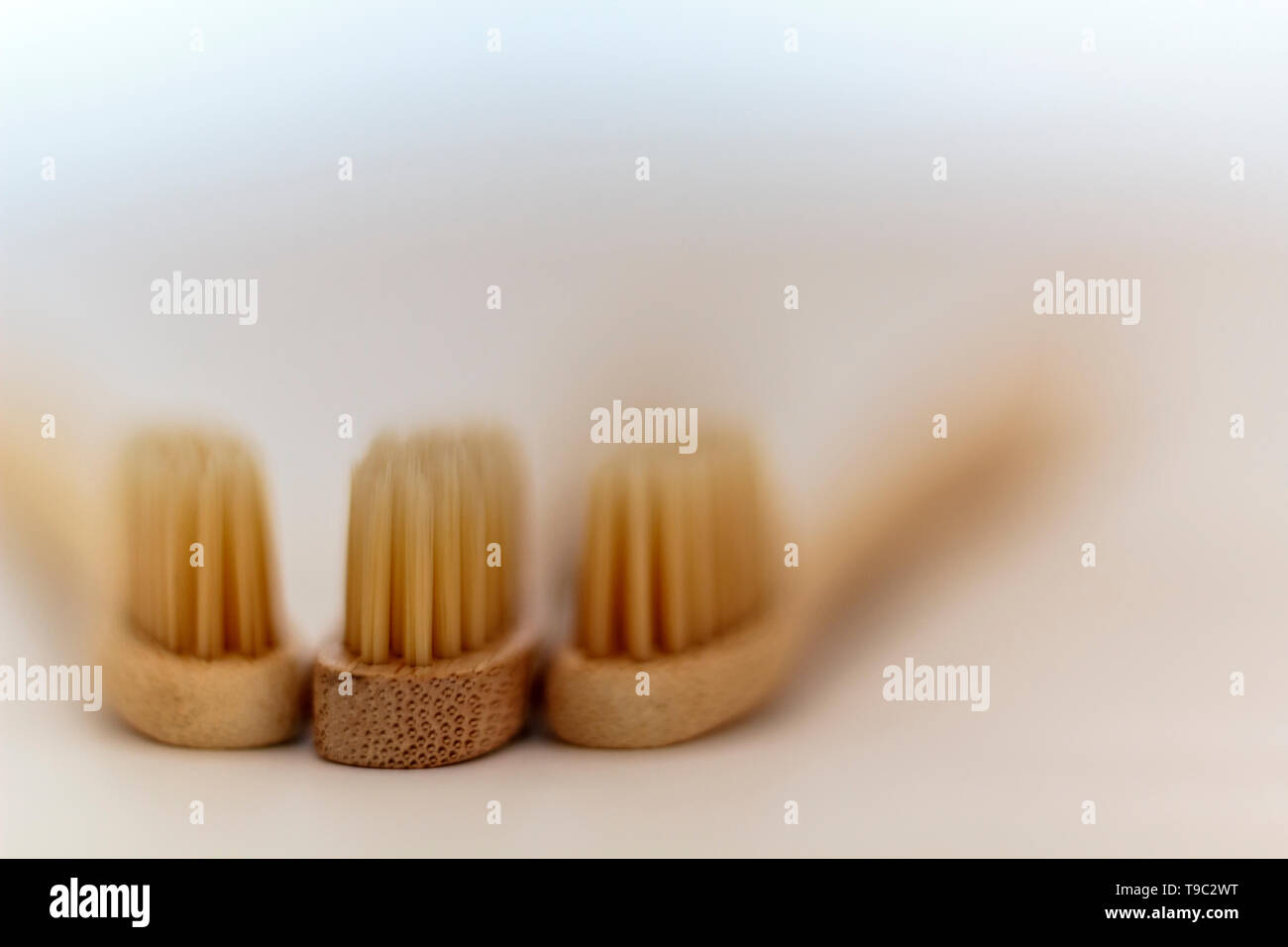 Bamboo toothbrushes on white background Stock Photo - Alamy