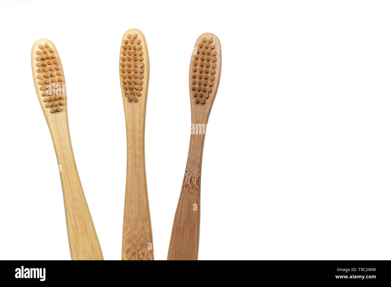 Wooden bamboo toothbrushes isolated on white background Stock Photo - Alamy