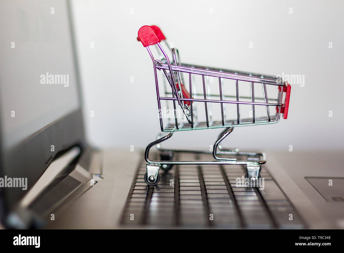 Trolley on computer keyboard. Online shopping concept Stock Photo Alamy