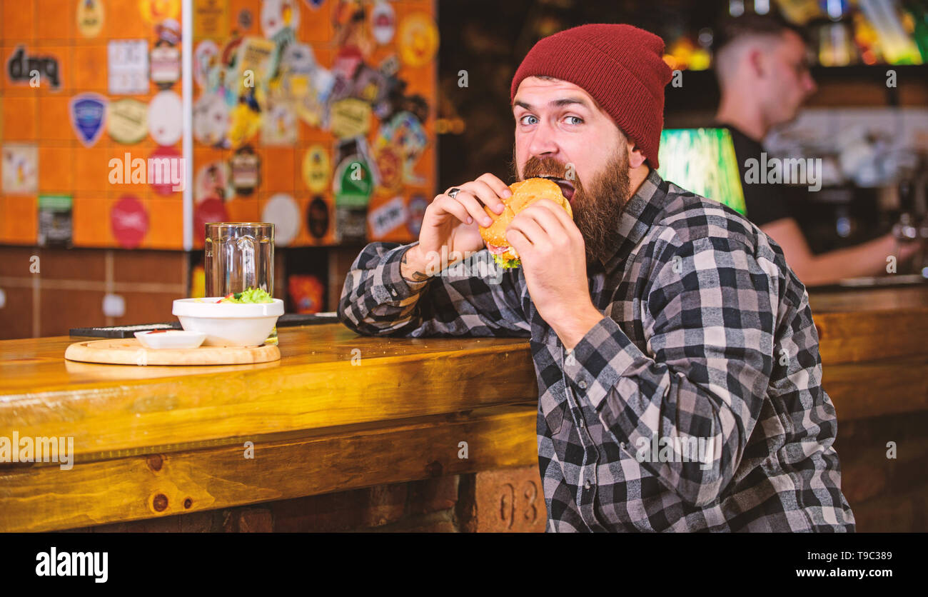 Delicious burger concept. Enjoy taste of fresh burger. Hipster hungry