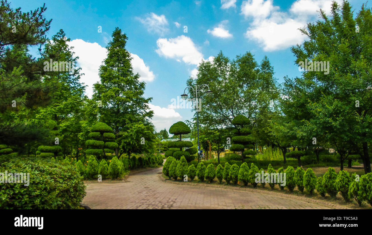 a landscape with blue sky and trees Stock Photo - Alamy