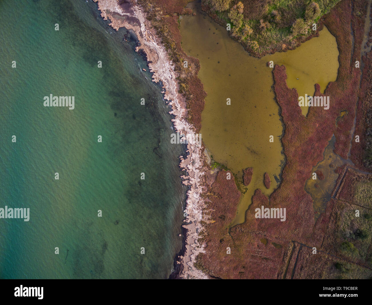 Aerial Drone View Of The Sea And Marsh Land Stock Photo 246749519