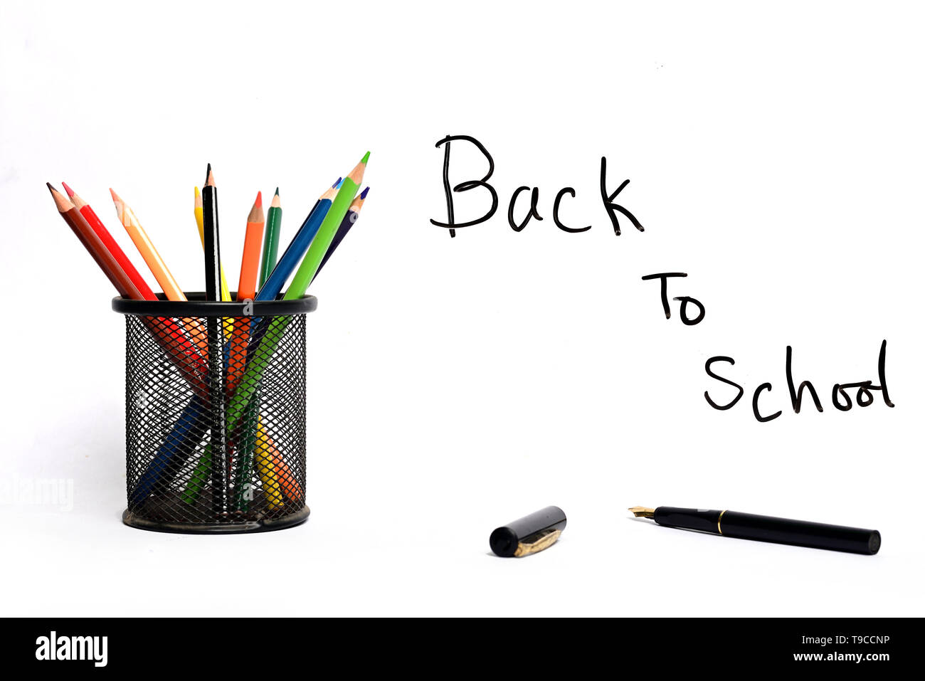 Back to school text with pencil container isolated on white background Stock Photo