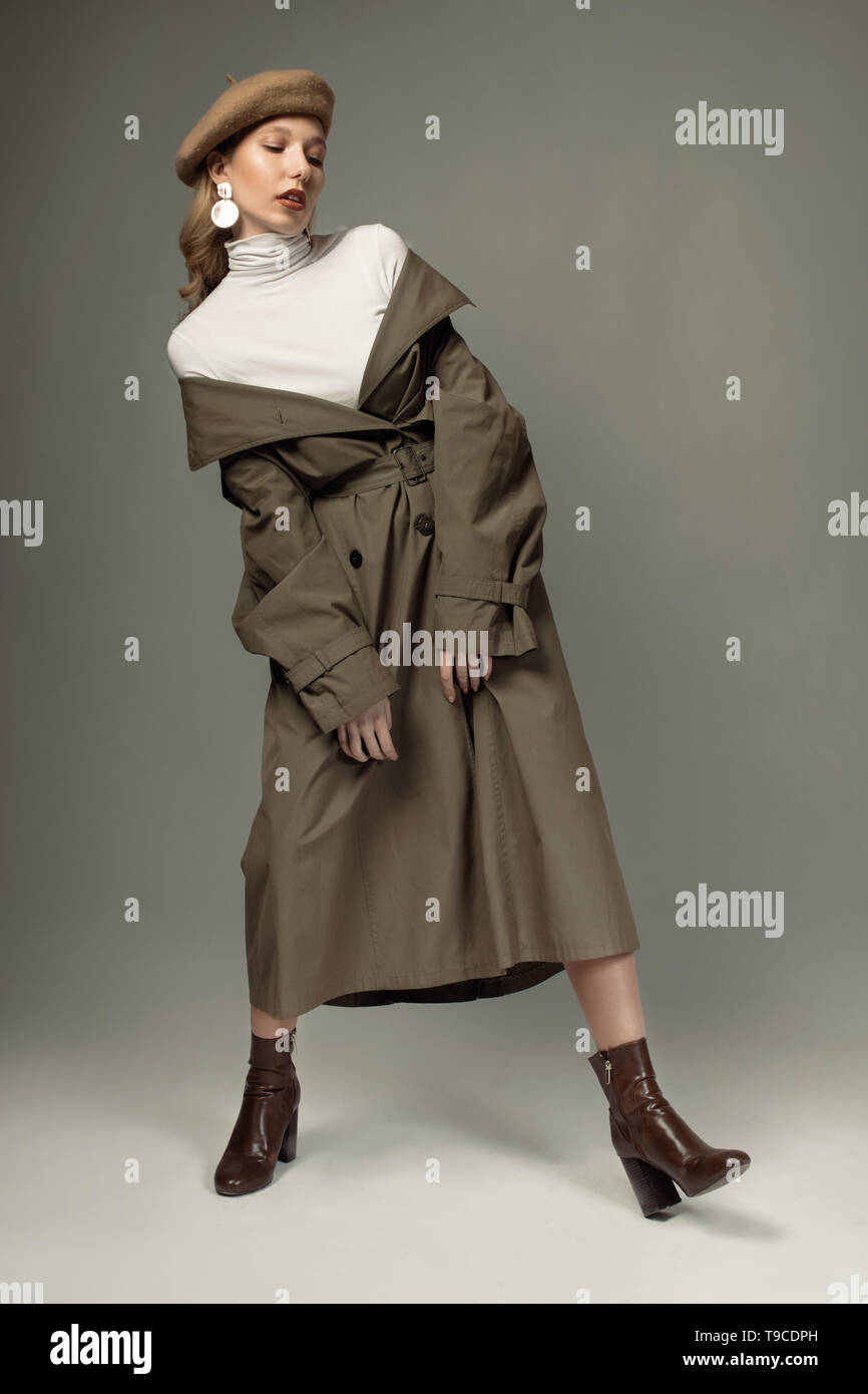 Woman wearing long coat hi-res stock photography and images - Alamy