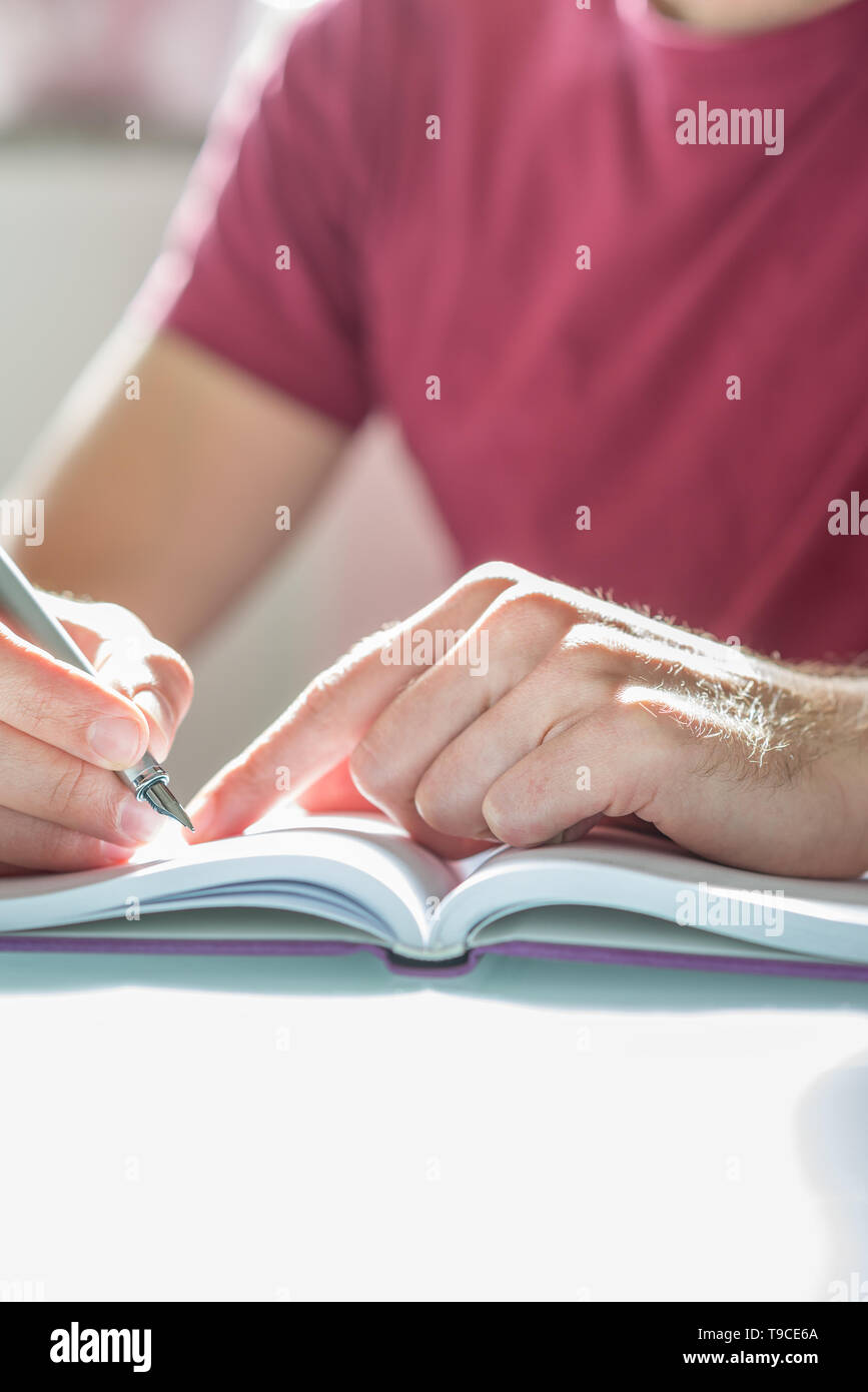 Close up Hand of a Studious Man with Fountain Pen Writing on his ...