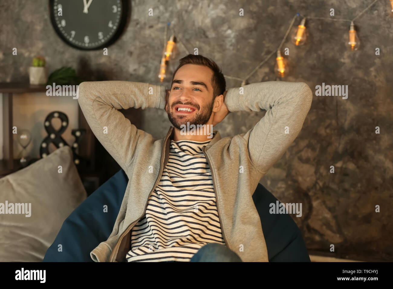 Man sitting on beanbag hi-res stock photography and images - Alamy