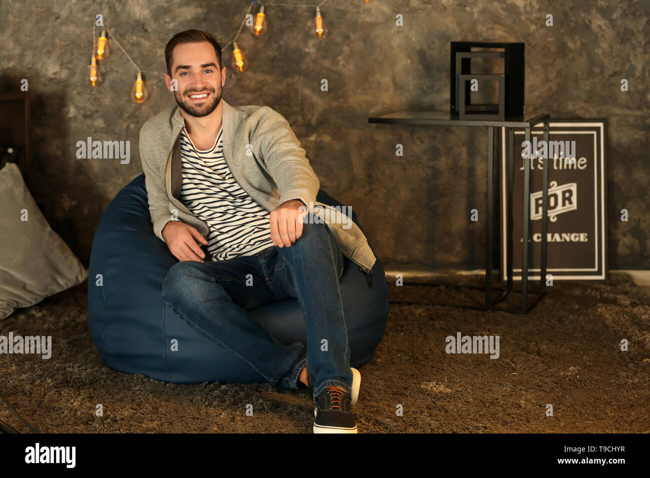 Man sitting on beanbag hi-res stock photography and images - Alamy